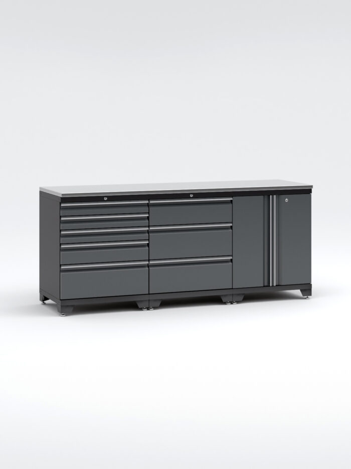 En stor, mörkgrå Garageinredning i metall med 3 delar - set 1, grå, PRO med flera lådor och ett skåp till höger är inställd mot en vanlig vit bakgrund, vilket framhäver dess eleganta och moderna design.